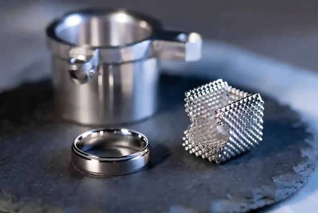 Platinum ring, catalytic converter, and lab crucible showing key industrial and jewelry uses of platinum